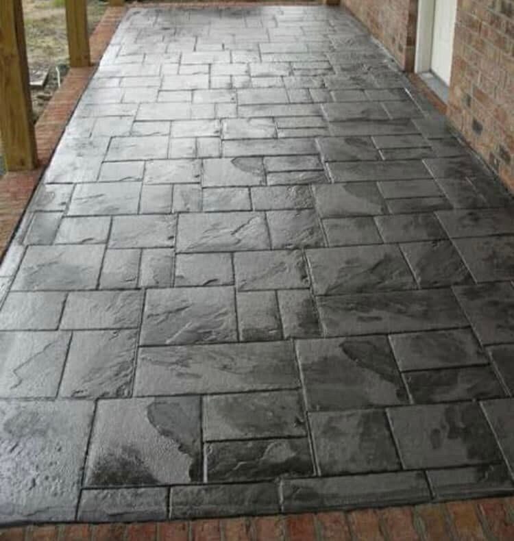 Stamped concrete walkway with an ashlar stone pattern