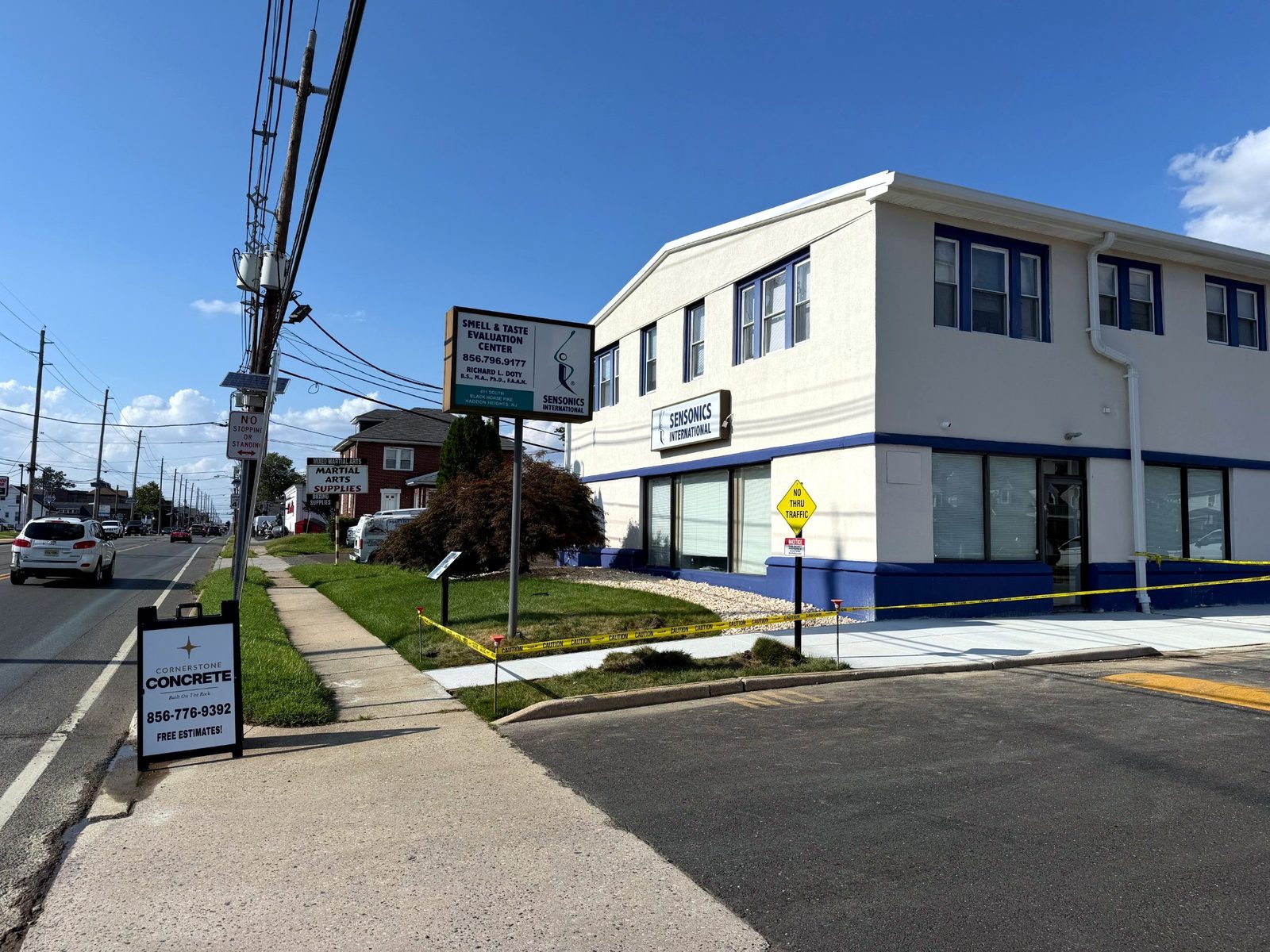 Commercial concrete sidewalk in front of a storefront building