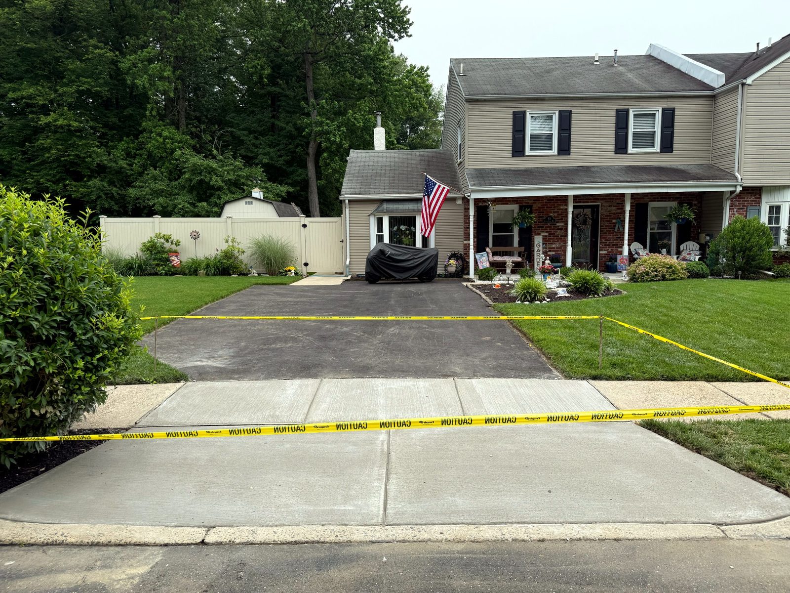 New concrete driveway poured in front of a two-story South Jersey home