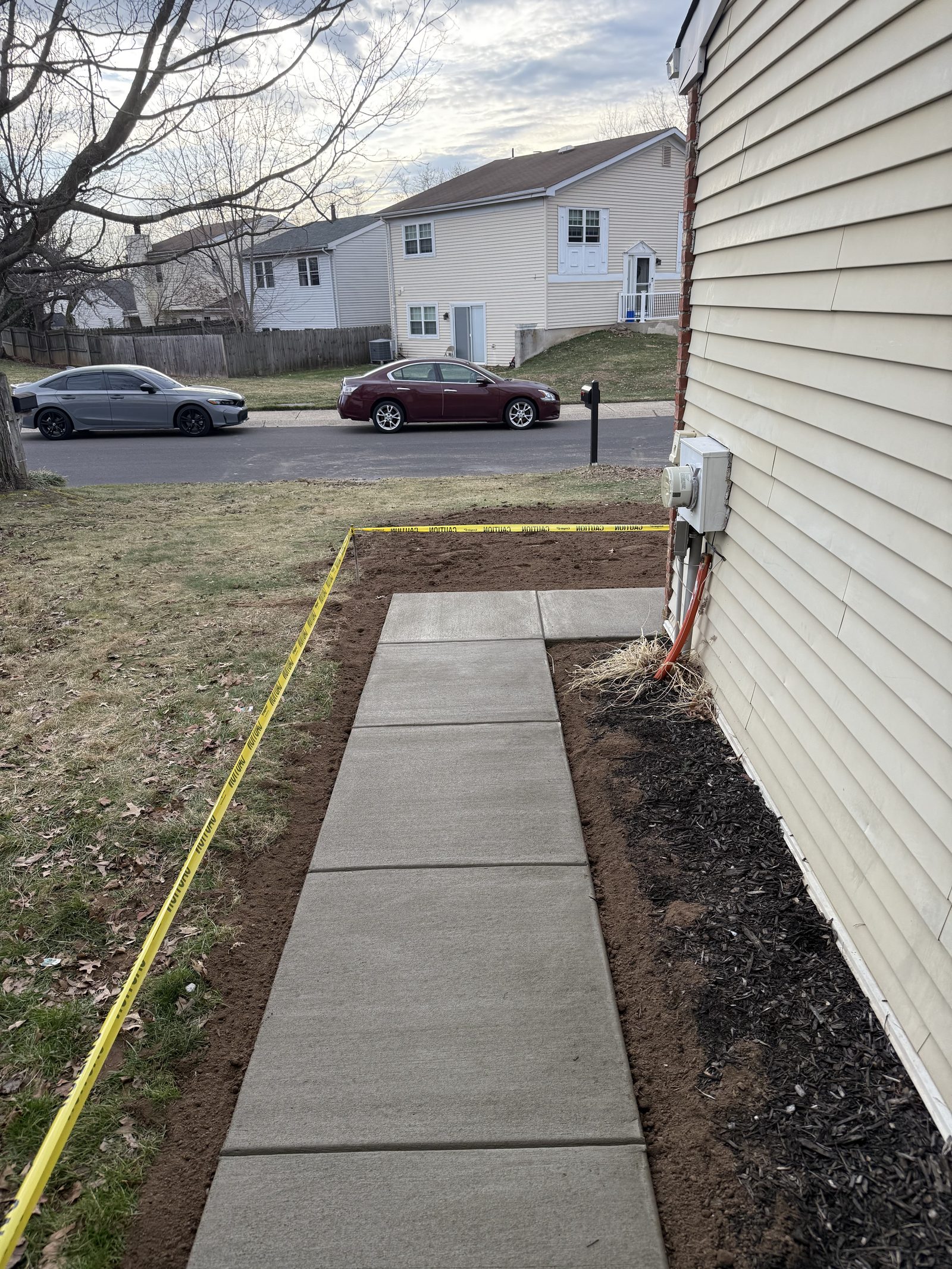Concrete walkway poured along the side of a South Jersey home