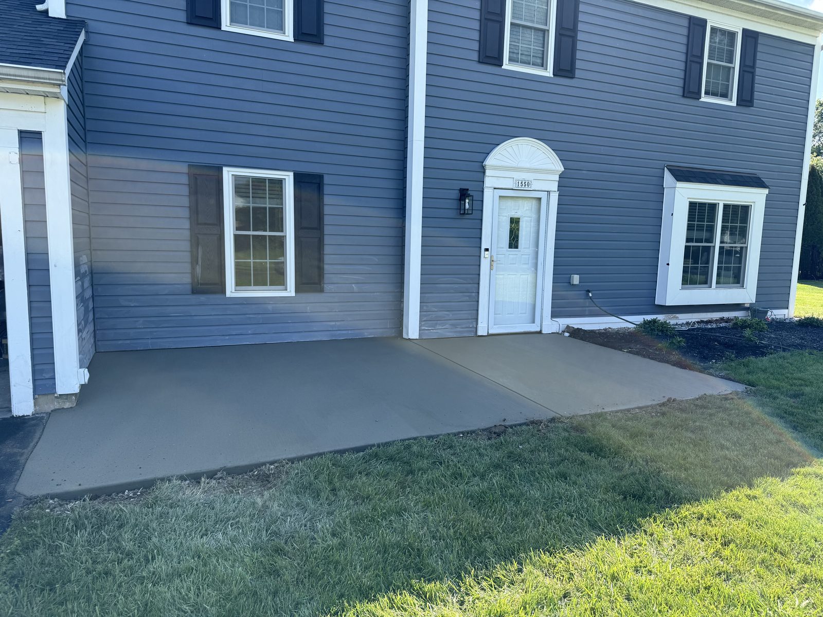Concrete patio poured at the rear entry of a South Jersey home