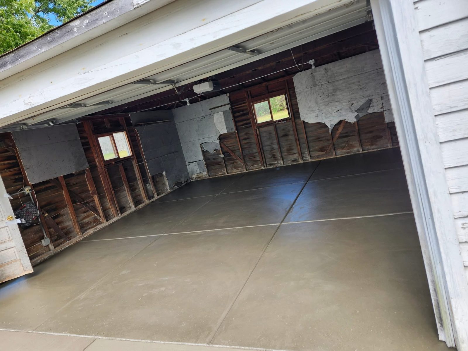 Finished concrete garage floor slab at a residential property